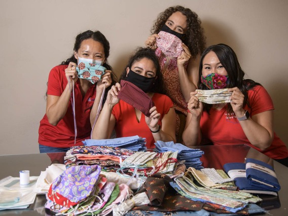 University of Arizona College of Medicine – Tucson students in the Commitment to Underserved People Program held a drive to help the Navajo Nation during the COVID-19 pandemic. Students Lynn Pham, Guadalupe Davila, Nicole Bejany and Thomasina Blackwater hold up face masks they sent to the Navajo Nation.