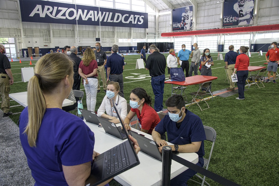 A new use for a practice field, testing is conducted in this climate controlled temporary clinic set up inside the Cole and Jeannie Davis Sports Center on the University of Arizona main campus.
