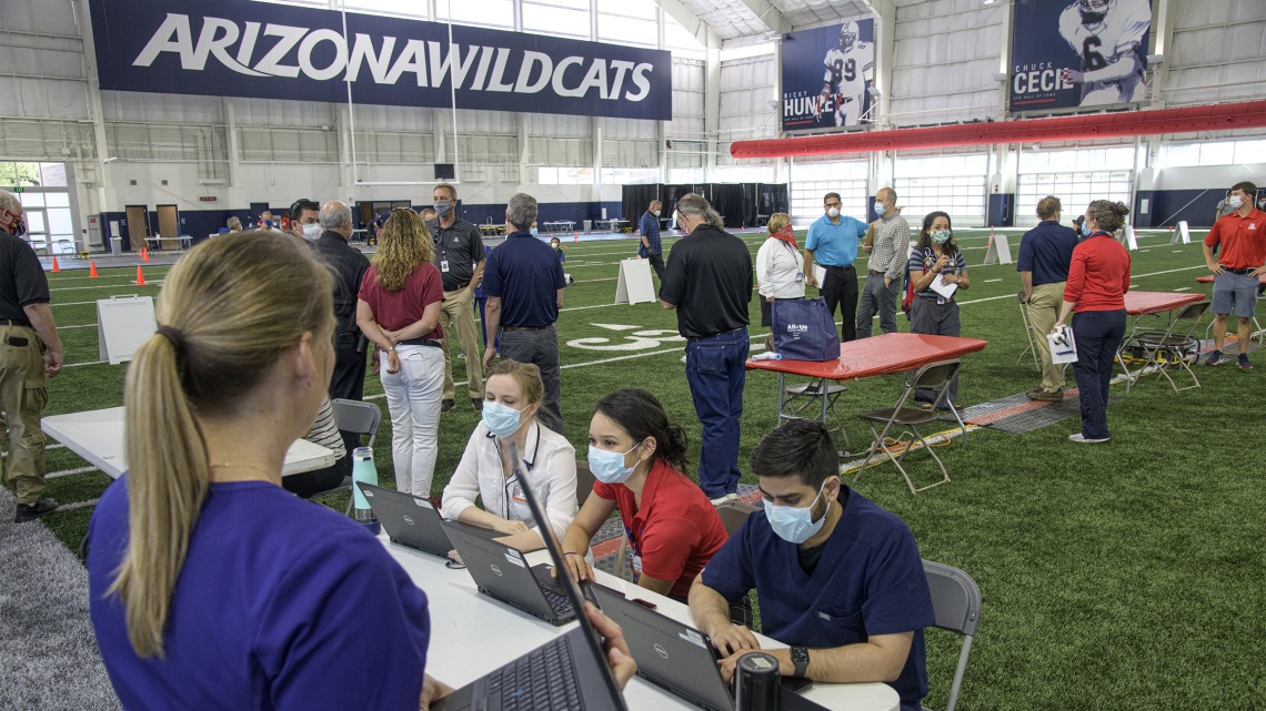 A new use for a practice field, testing is conducted in this climate controlled temporary clinic set up inside the Cole and Jeannie Davis Sports Center.