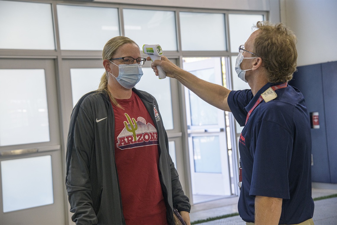 Upon arrival at the testing facility, all individuals are required to wear a mask, and have their temperature checked by health care personnel.