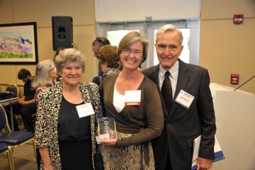 Leslie Boyer, MD, is flanked by her mother, Georgie Boyer, MD, and father, Jack Boyer, MD, at the College of Medicine – Tucson’s Innovation Day in 2013. 
