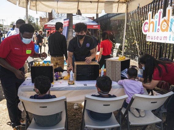 Student volunteers from the University of Arizona R. Ken Coit College of Pharmacy and Medical Directive students show kids where germs like to hide on your hands and demonstrate the importance of washing your hands well during the recent Family SciFest at Children's Museum Tucson.
