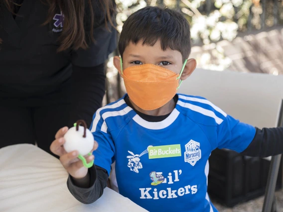 Jay Mendoza holds a virus he made out of a foam ball and pipe cleaners during the recent Family SciFest at Children's Museum Tucson.