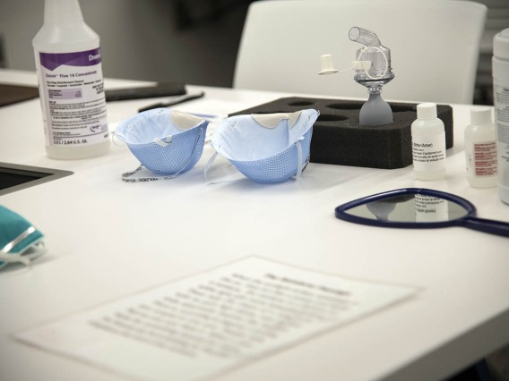 Items on a table used for N95 mask fitting.
