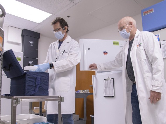 David Harris, PhD, executive director of the UArizona Health Sciences Biorepository (right), and Michael Badowski, PhD, associate research scientist in the Division of the Translational and Regenerative Medicine in the Department of Medicine at the College of Medicine – Tucson (left), are tasked with monitoring the “freezer farm.”