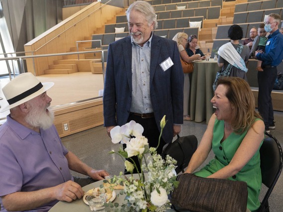 Andrew Weil, MD, Dan Derksen, MD, associate vice president for Health Equity, Outreach and Interprofessional Activities at UArizona Health Sciences, and Victoria Maizes, MD, visit during a reception after the groundbreaking for the Andrew Weil Center for Integrative Medicine.