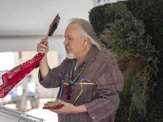 Carlos Gonzales, MD, assistant dean, curricular affairs at the UArizona College of Medicine – Tucson, leads a blessing ceremony using a prayer to the Seven Sacred Directions before the groundbreaking for the Andrew Weil Center for Integrative Medicine on the University of Arizona Health Sciences campus in Tucson.