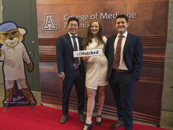 University of Arizona College of Medicine – Phoenix students (from left) Robert Yang, Michelle Peterson and Joseph Neely pose for a photo together before the start of UArizona College of Medicine – Phoenix Match Day 2022 event.