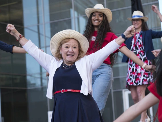 Kelly Lynch (center), alumni/student relations manager at College of Medicine – Phoenix, along with faculty, staff and medical students surprise the  class of 2022 with a dance before the start of the Match Day event.