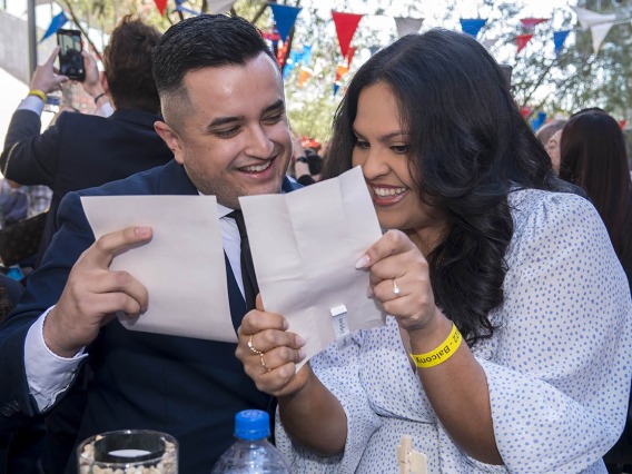 Jesus Sandoval and Valeria Vasquez read their match letters to see where they were matched during the College of Medicine – Phoenix Match Day 2022 event.