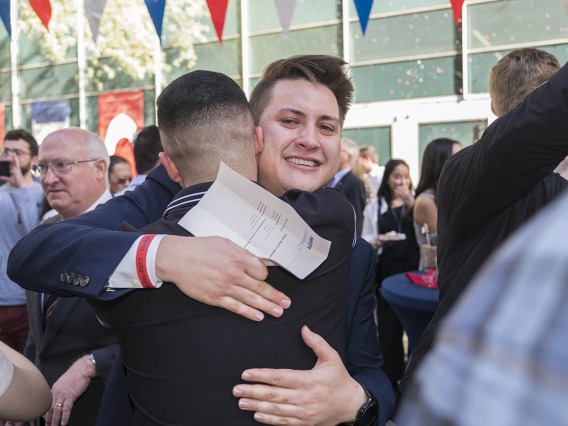 Med student Joseph Neely hugs a classmate celebrating his match during the UArizona College of Medicine – Phoenix Match Day 2022 event.