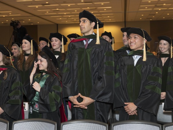 (Front row from left) Merrion Dawson MD, Nicole Deatherage, MD, Gurman Dhaliwal, MD, and Allen Doan, MD, stand for the conclusion of their College of Medicine – Phoenix class of 2022 commencement ceremony. 