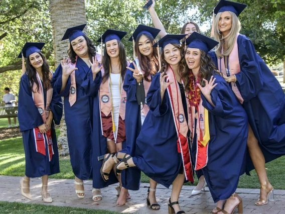 Public health undergraduate students are all smiles as they prepared to enter Centennial Hall for the 2022 Mel and Enid Zuckerman College of Public Health spring convocation.