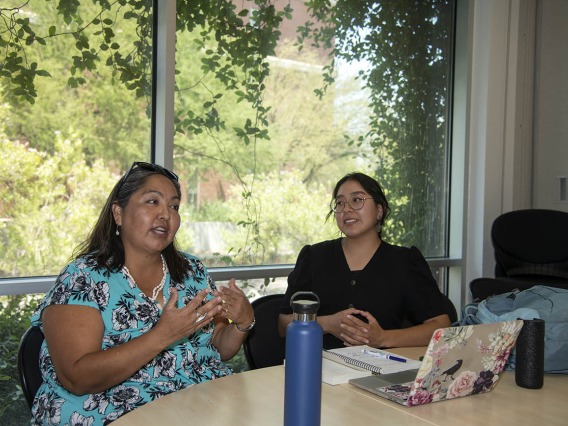 Diné College program manager Kaitlyn Haskie (right) meets with Agnes Attakai, MPA, (left) of the College of Medicine – Tucson, for a mentoring session. Haskie studied health disparities among Native populations this summer.