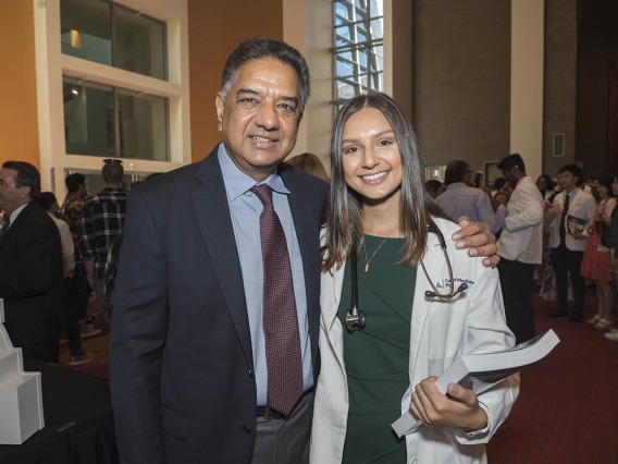 Nina Gautam poses for a photo with her father, Madhur Gautam, after the UArizona College of Medicine – Phoenix Class of 2026 white coat ceremony.