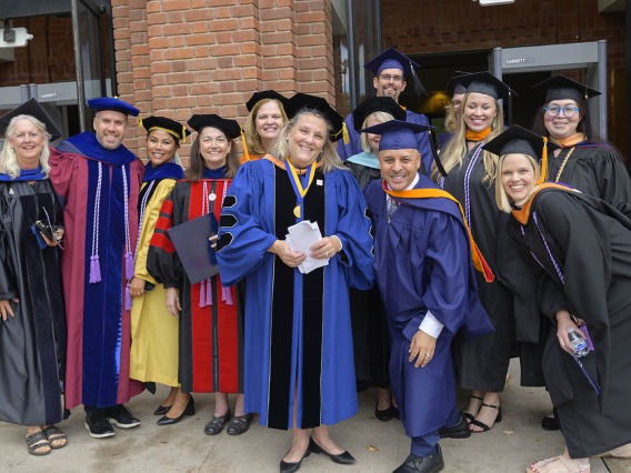 College of Nursing faculty from Tucson and Phoenix gather outside of Centennial Hall after the college’s 2022 summer convocation.
