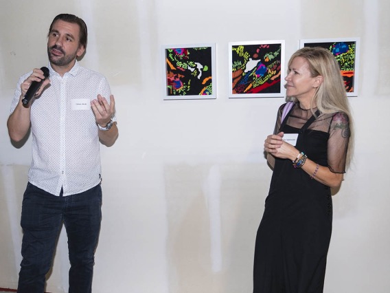 (From left) Tobias Jakobi, PhD, an assistant professor in the College of Medicine – Phoenix, talks about his experience collaborating with artist Denise Yaghmorian on “Layers of Cardiac Fibers” during the Artist + Researcher VIP exhibition opening on the Phoenix Bioscience Core.