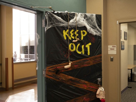 Given the state of the doll parts hanging on the door to the College of Nursing’s Office of Student and Academic Affairs, it might be best to heed the warning and keep out this Halloween. 