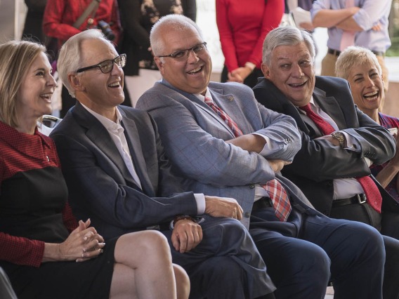 VIPs at the ceremony announcing the $50 million gift and naming of the R. Ken Coit College of Pharmacy laugh as UArizona President Dr. Robbins jokes during his speech.  