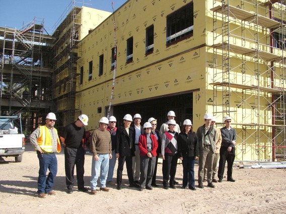 Faculty and staff take their first tour of Roy P. Drachman Hall in 2005, the future home of the Mel and Enid Zuckerman College of Public Health.