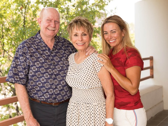 Ginny Clements (center), with her husband, Tom Rogers, and daughter, Kimberly Clements.
