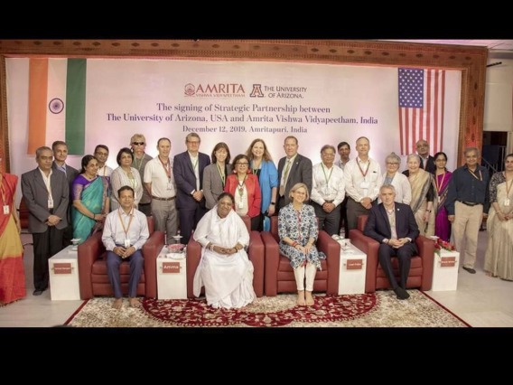 Members of the Global Health Institute attend a 2019 signing ceremony for a partnership between the University of Arizona and Amrita University in Amritapuri, India.