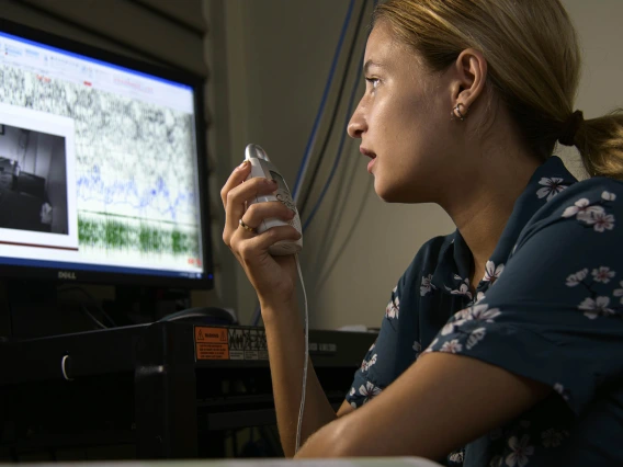 Caleigh Shepard, a former specialized research assistant, speaks to a sleep research study participant in the UArizona Social, Cognitive, and Affective Neuroscience Lab (SCAN Lab).