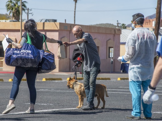 Christian Bergman, left, is a medical student volunteering to serve the homeless population of Tucson with medical services during the worldwide pandemic COVID-19 outbreak.