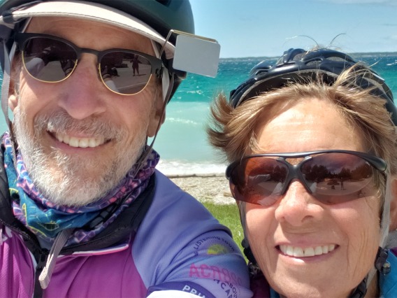 College of Medicine – Tucson professor Paul Gordon, MD, MPH, and his wife Eve Shapiro, professor emeritus, stop along the shore of Lake Michigan.