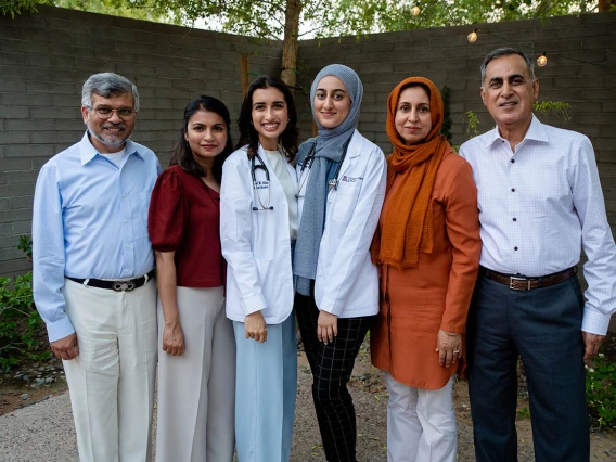 Amal Altaf and Noor Basharat with their families after the ceremony.