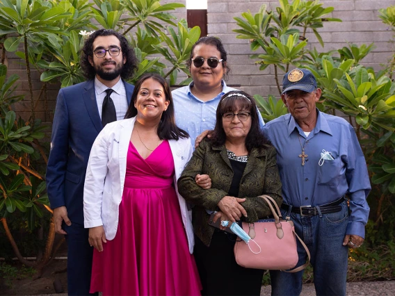 Elen Mendoza, front left, with her family after the white coat ceremony.