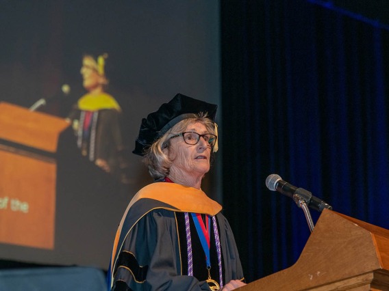 Ki Moore, PhD, RN, FAAN, dean of the College of Nursing, speaks during the commencement ceremony at Centennial Hall.