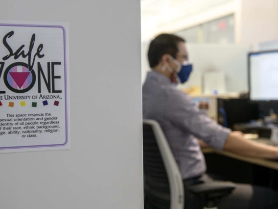 Matt Peters uses a Safe Zone placard to signal an inclusive work environment and spread awareness of training opportunities.