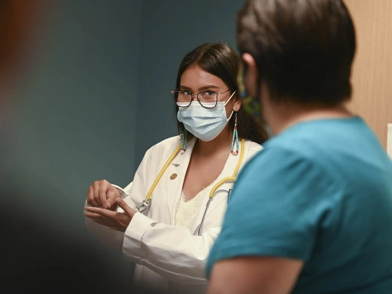 Health Sciences intern, Sophia Murphy, role-played as a doctor, practicing clinical skills with a patient, during the field trip.