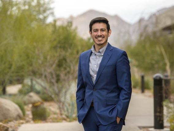 Portrait of David O. Garcia, PhD, from the University of Arizona Mel and Enid Zuckerman College of Public Health standing outside