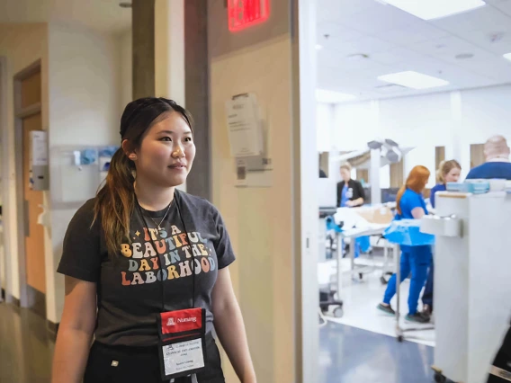 midwifery student walking past the simulation lab