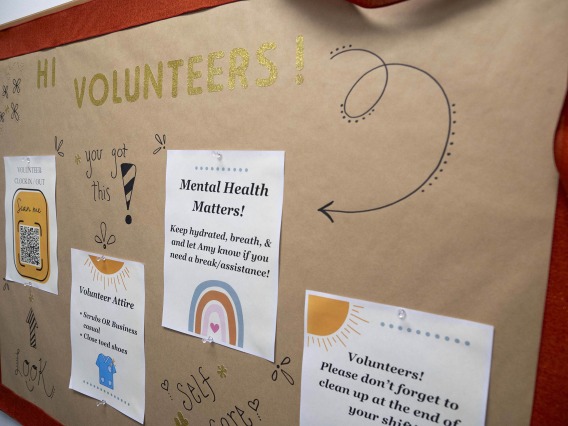 bulletin board welcomes volunteers with four flyers of useful information
