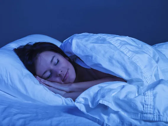 woman sleeping peacefully in bed at night