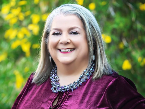 Portrait of Dr. Teshia Solomon in an outdoor setting.