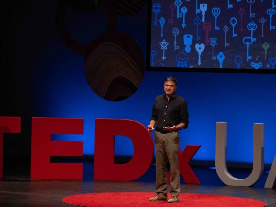 Dr. Deepta Bhattacharya giving a talk on the TEDx stage