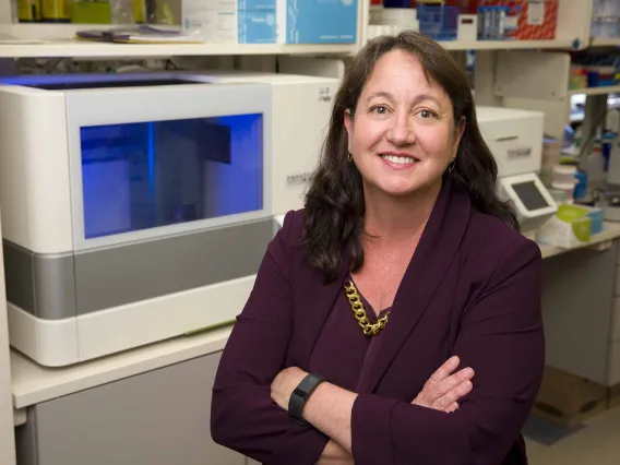 Portrait of Lisa Rimsza, MD, in a research laboratory