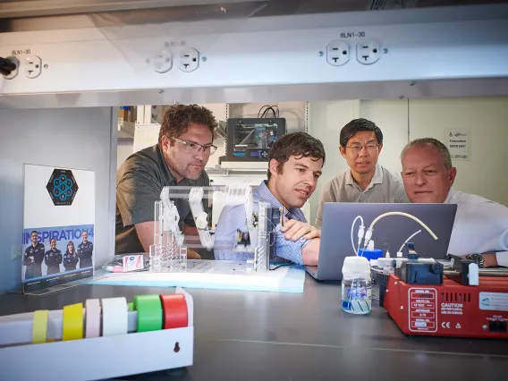 four researchers in a lab at the University of Arizona College of Medicine – Phoenix