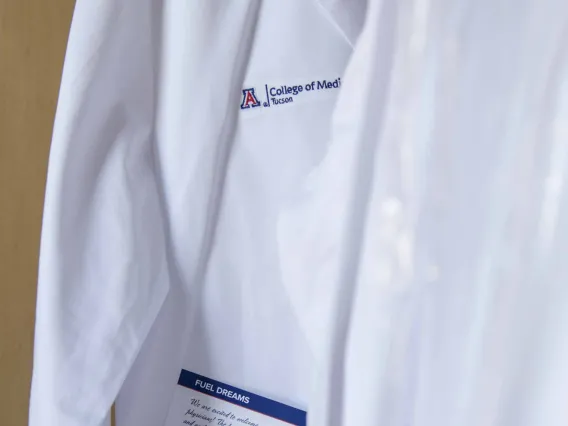 physician's white coat with College of Medicine – Tucson logo