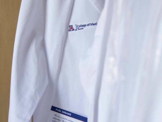 physician's white coat with College of Medicine – Tucson logo