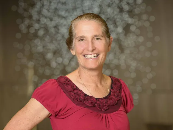 Portrait of Lisa Kiser standing in the Health Sciences Innovation Building.