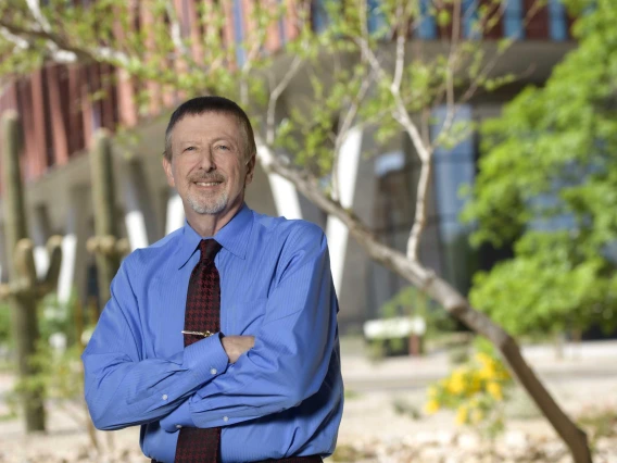 Portrait of Michael Katz, PharmD, standing outside of the Health Sciences Innovation Building in Tucson.