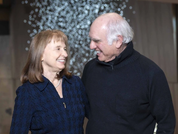 Karen Weihs, MD, and Richard D. Lane, MD, PhD, looking at each other and smiling.