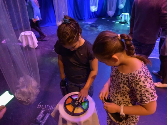 Two children play a light up memory game