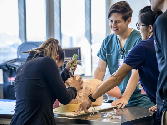 A medical student practices on a simulated airway.