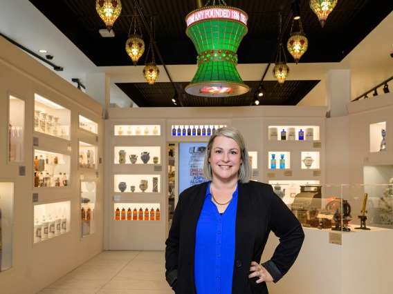 New Coit Museum of Pharmacy & Health Sciences director Alexis Peregoy stands in the newly renovated museum space. 